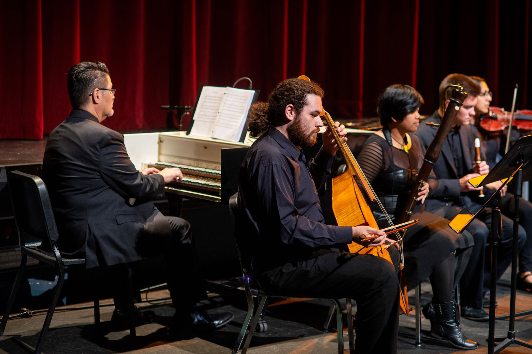 Music students performing in an auditorium.