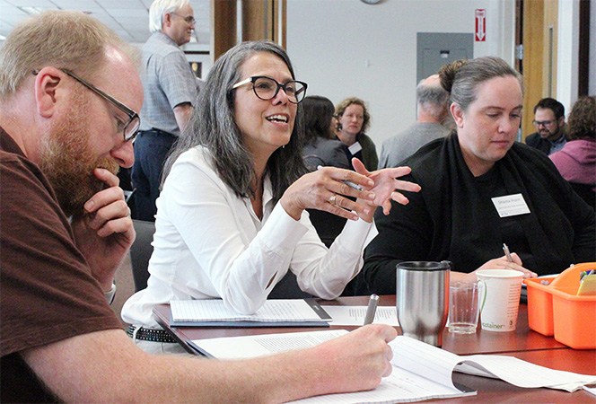 Conference attendees engaging in conversations