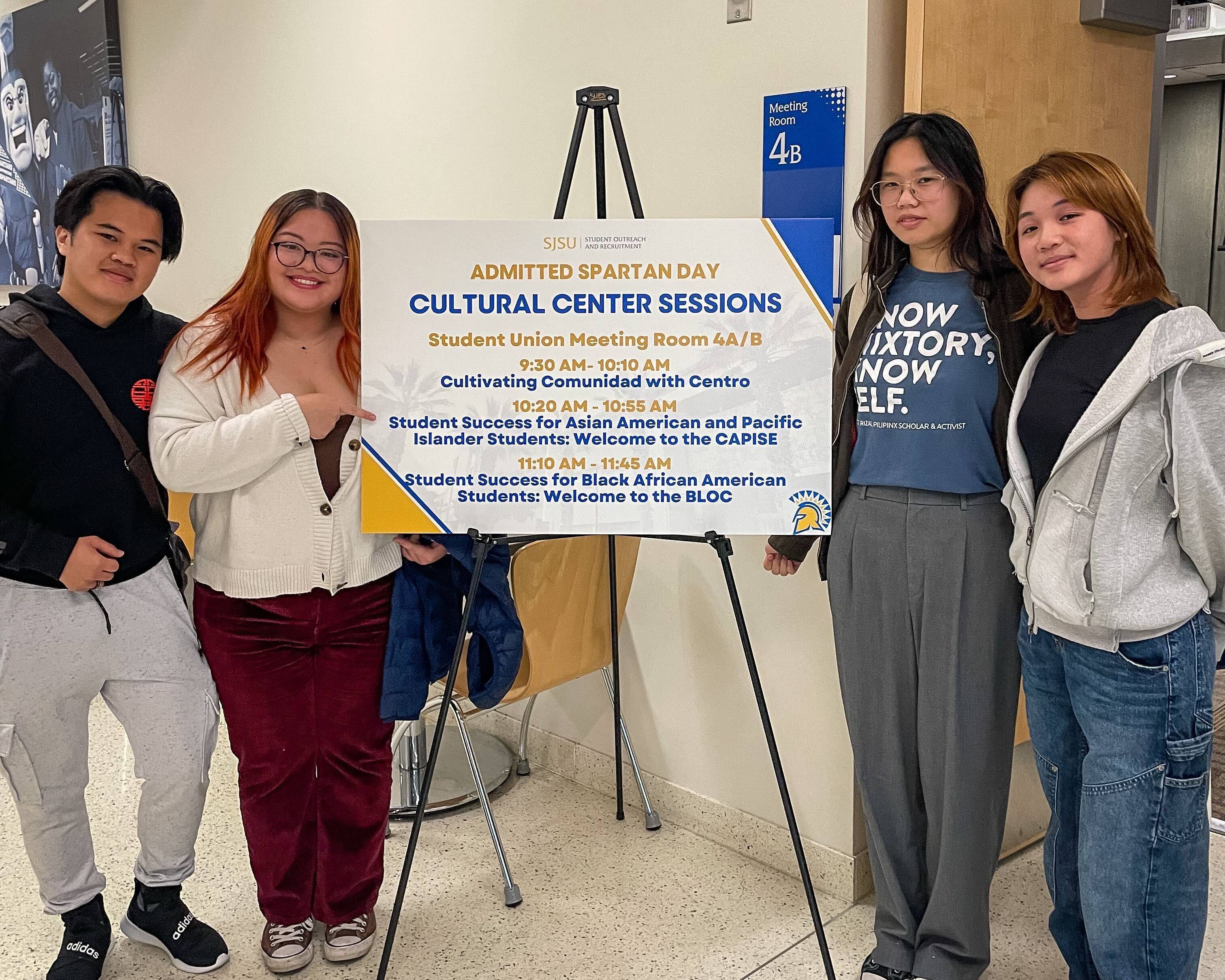 CAPISE staff and Empower Mentors with a Admitted Spartans Day sign