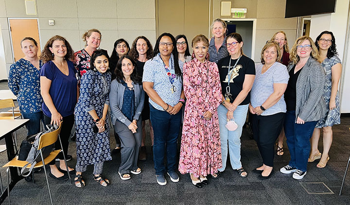 photo shows SJSU president with fifteen faculty