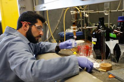 student working with lab equipment