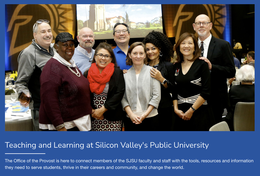 Hero image of faculty posing for a group photo.