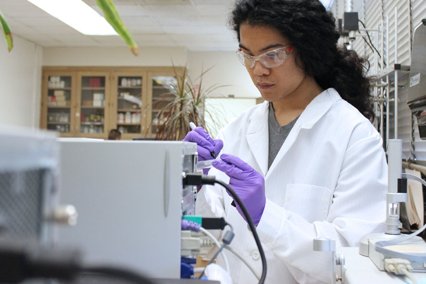 Chemistry student working in a lab.