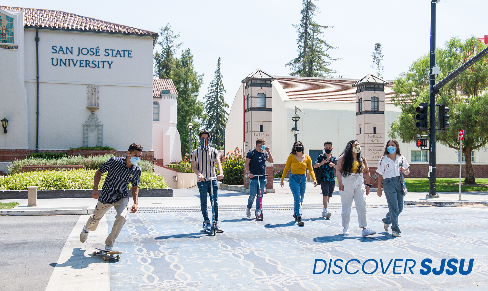 Students wearing face masks crossing 4th street on the paseo.