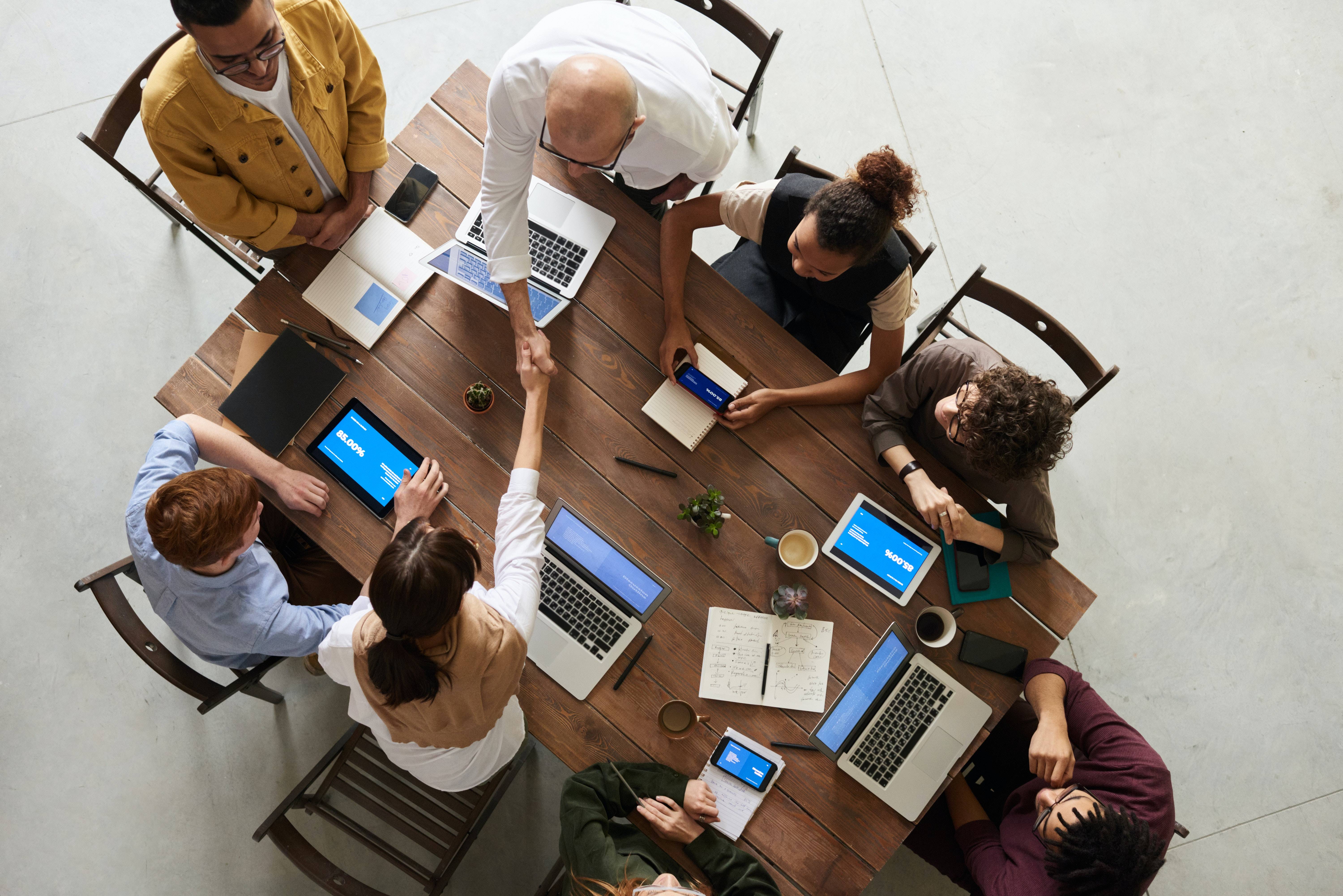 a group of collegues sitting in a table 