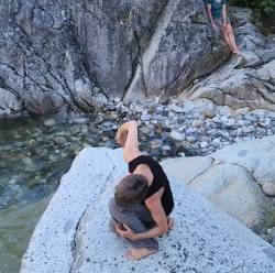 Photo of Elise Knudson dancing on a rock.