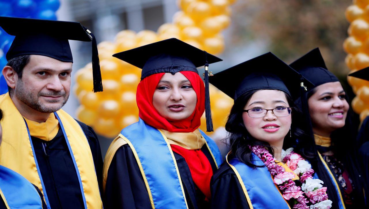 Several students at graduation.