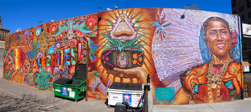 alebrijes mural on side of mezcal restaurant