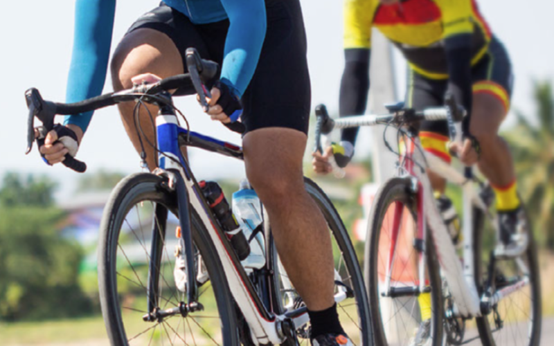 image of two people riding bikes