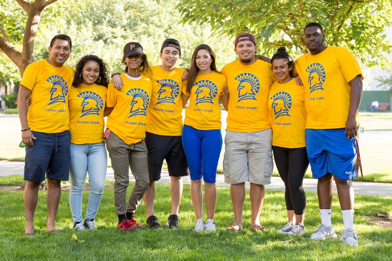 Students arm-in-arm in SJSU logos