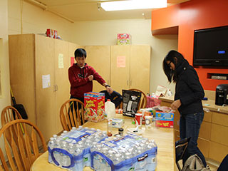 Residents Storing Groceries in Student Kitchen