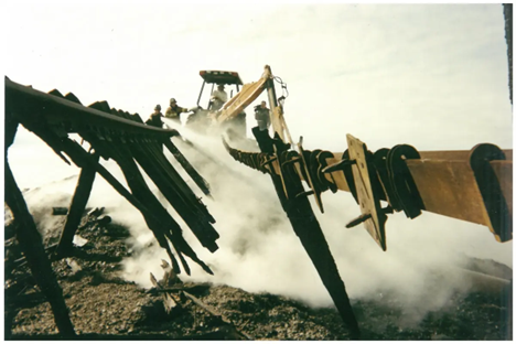 Farm tractor plowing dirt