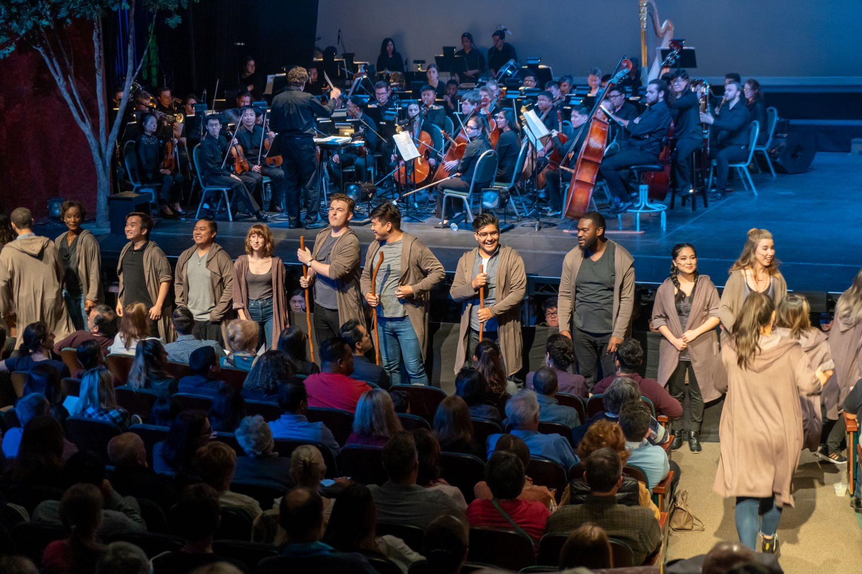 Groups of performing ensembles on stage.