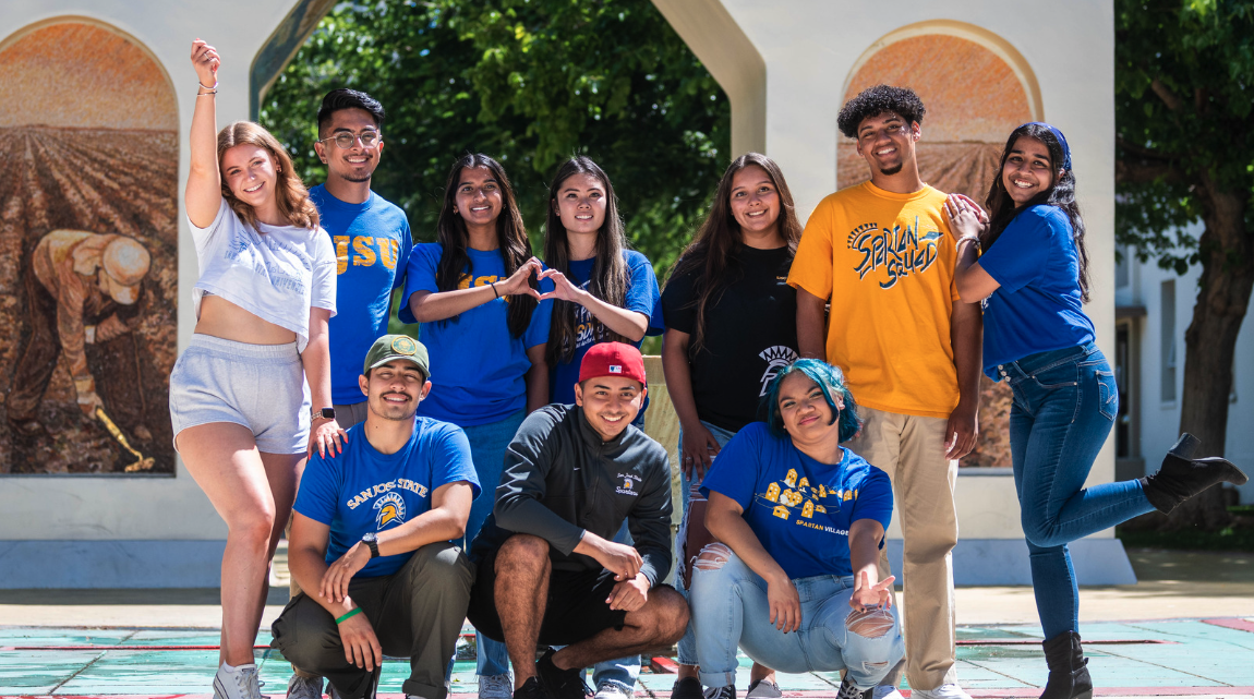 Student walking under Cesar Chavez Arch