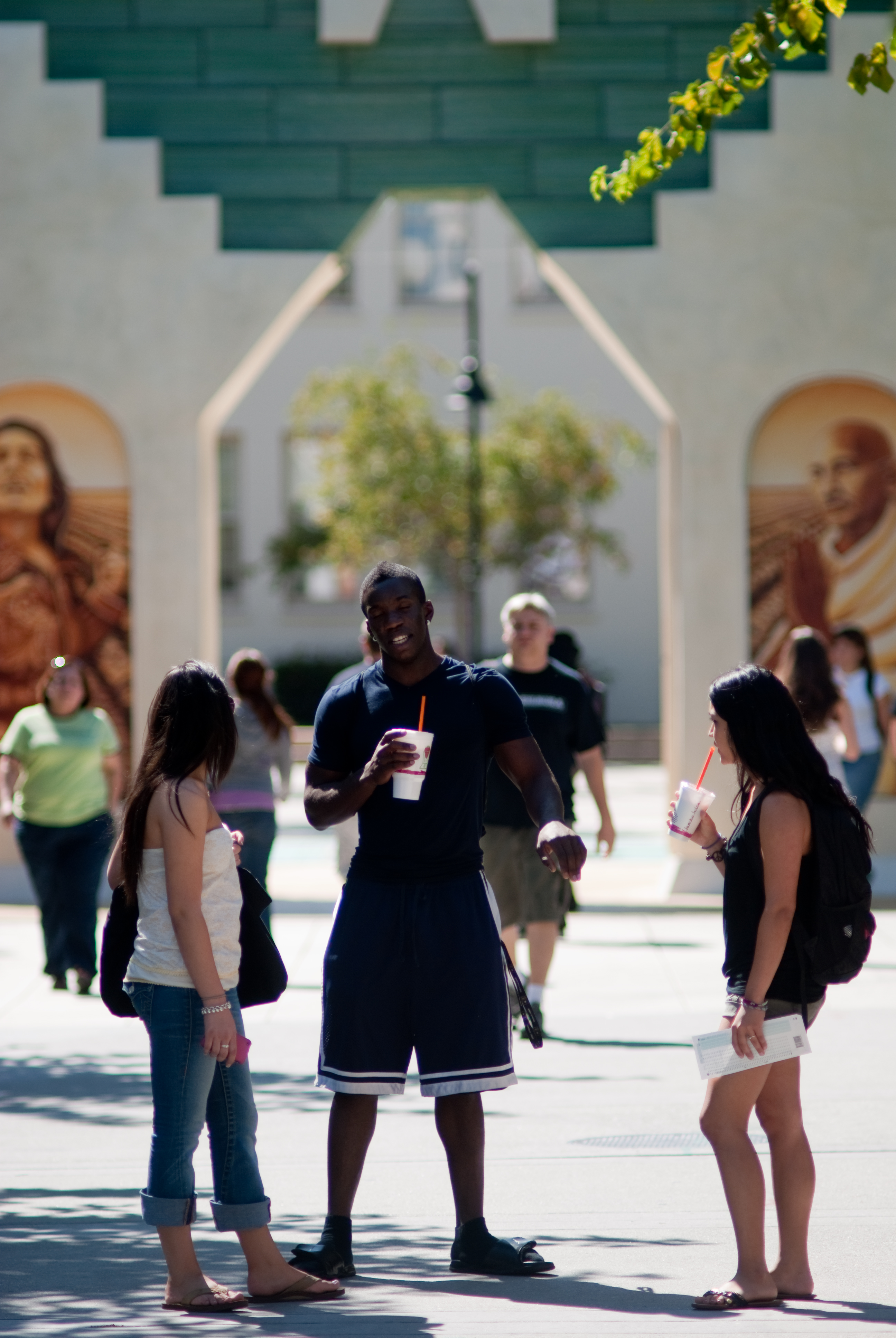 sjsu students conversing in front of Cesar Chavez plaza