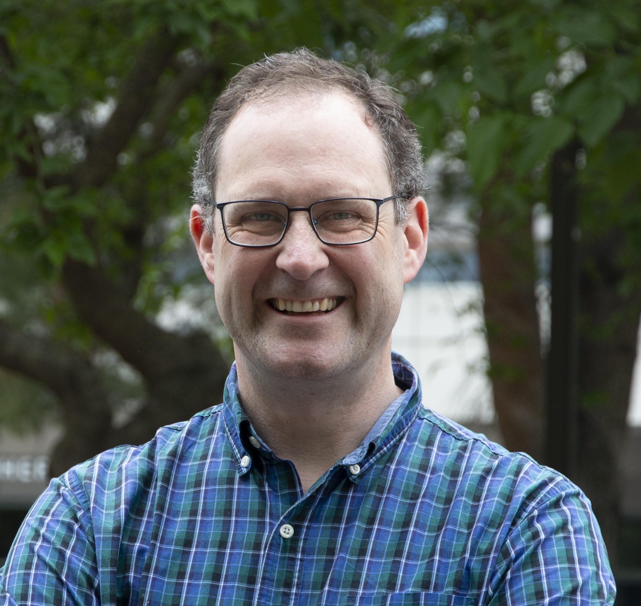 Headshot of Christopher Smallwood.