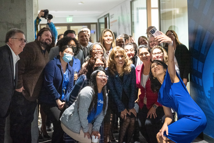 President Teniente-Matson posing with office staff.