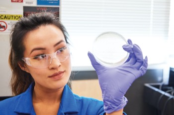 Student with agar plate