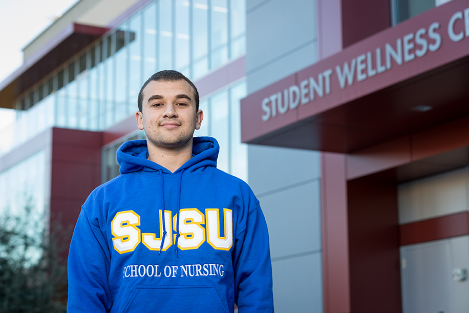 Student outside of Student Wellness Center.