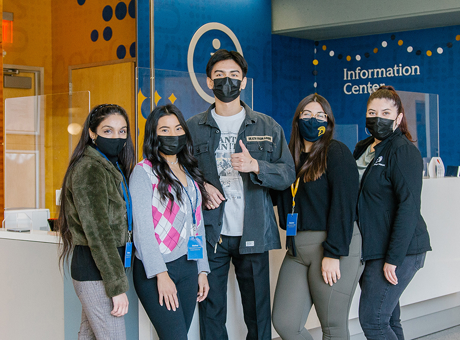 A picture of two student employees at the Information Center.