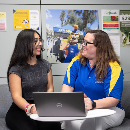 student being helped by staff member at sjsu cares